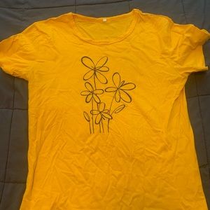 Simple yellow shirt with flower detail